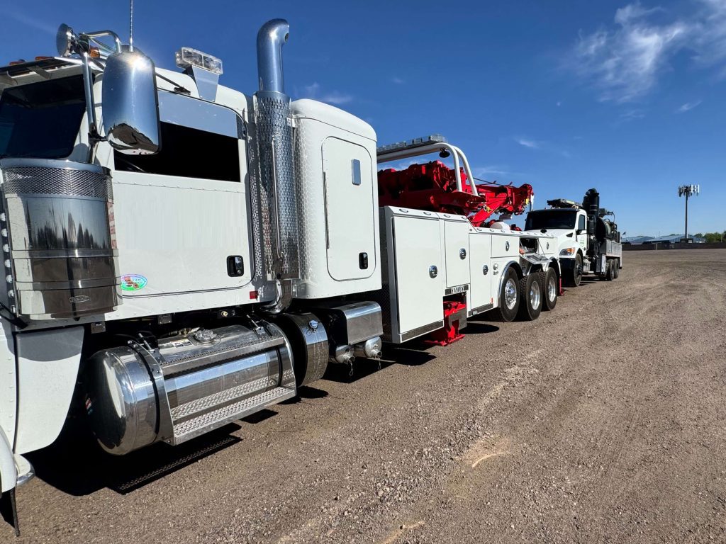 white heavy duty tow truck and repair vehicles